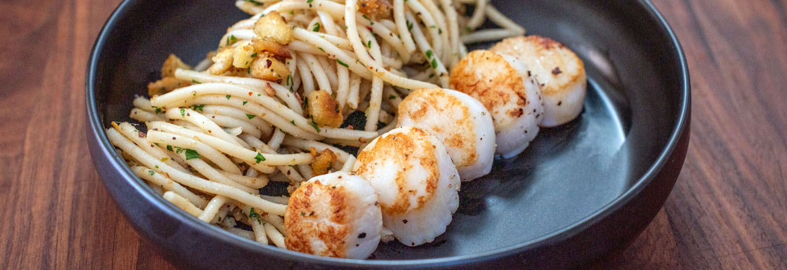 Seared Sea Scallops alla Siciliana with spaghetti, breadcrumbs and herbs Lighthouse Seafoods recipe.